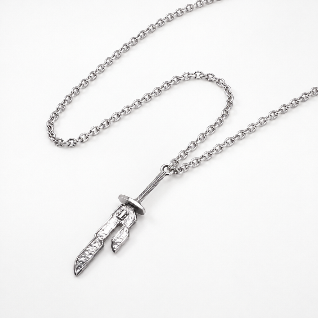 Spear of Heaven necklace lying on a white background with the chain looped